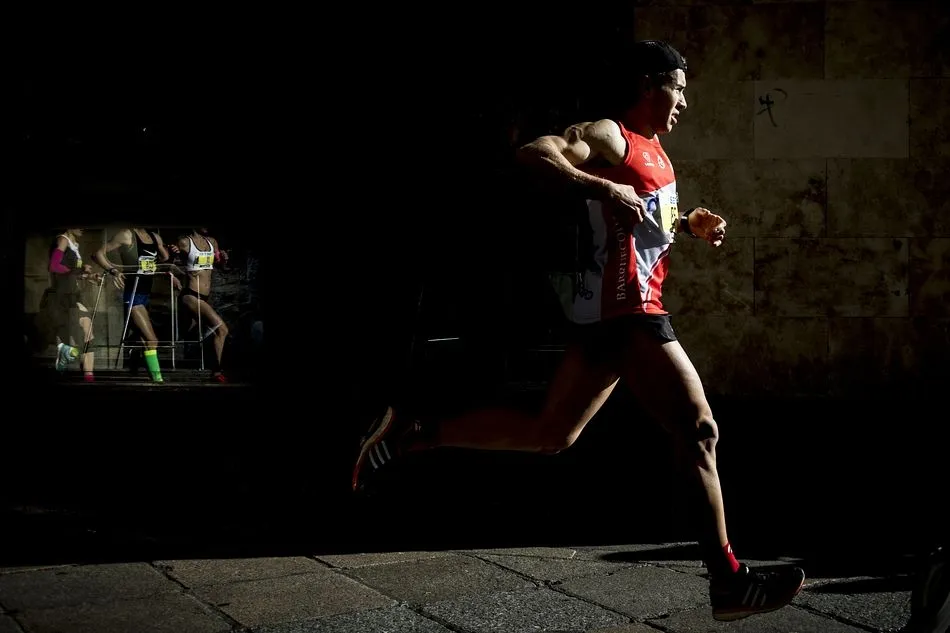 Primer premio del concurso fotográfico de la San Silvestre Salamantina. David Gómez Rollán. Reflejos de esfuerzo