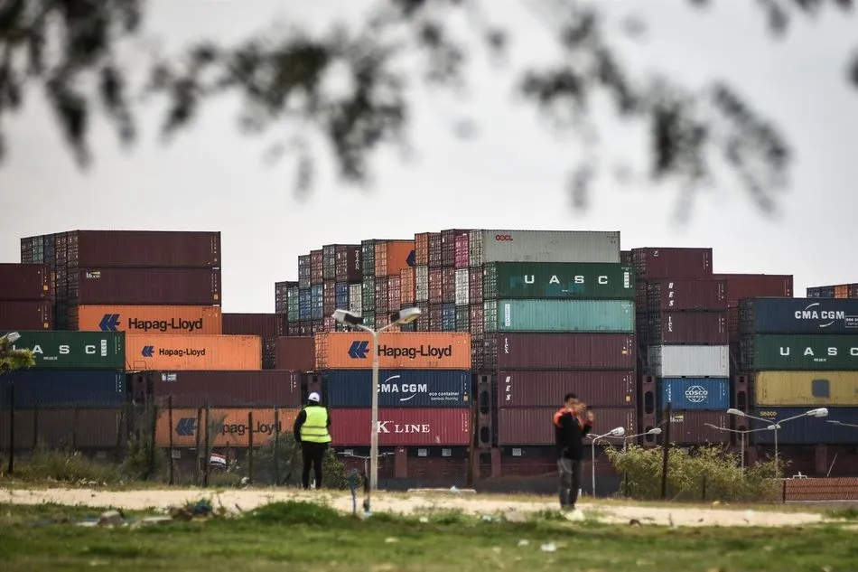 30 March 2021, Egypt, Ismailia: A cargo ship sails in the Suez Canal in Ismailia today, Tuesday. Traffic in the Suez Canal on Monday resumed hours after the Ever Given container ship operated by the Evergreen Marine Corporation, which blocked the crucia